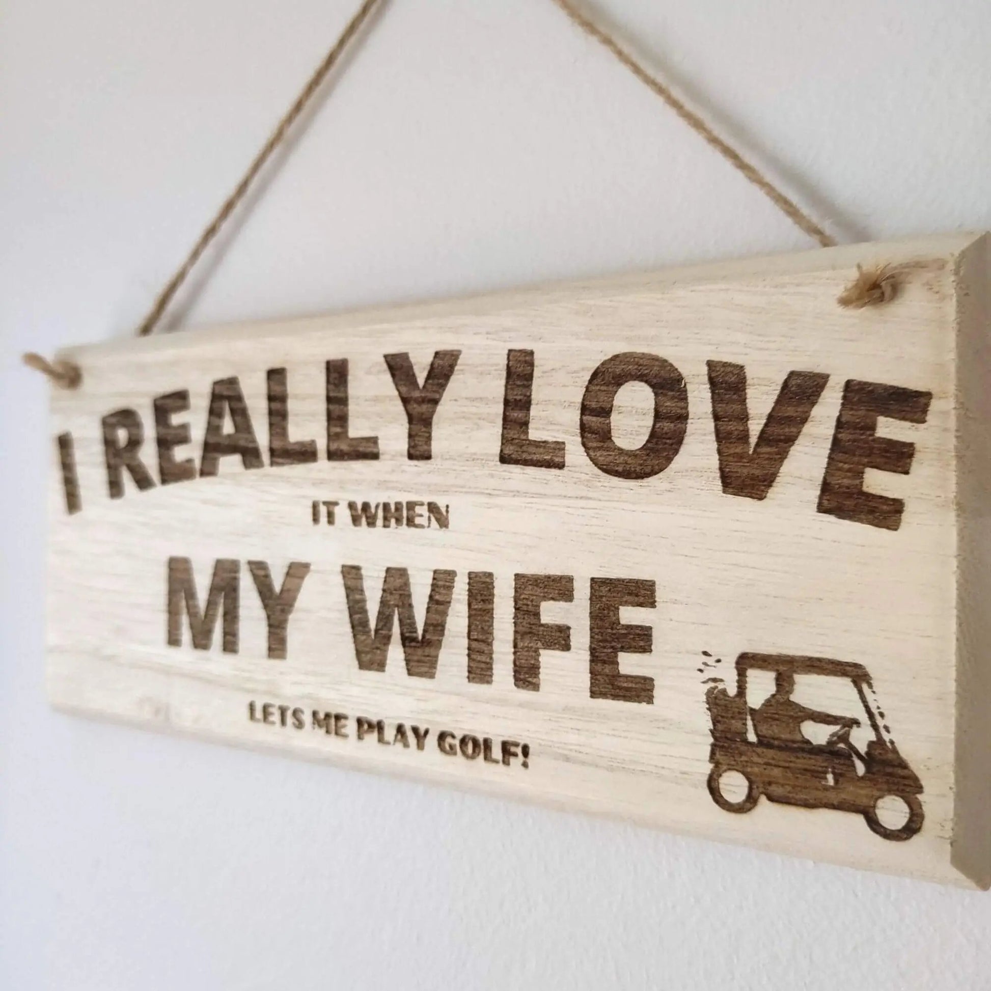 https://www.golfgiftsdirect.com/cdn/shop/products/wooden-golf-hanging-sign-i-really-love-it-when-my-wife-lets-me-play-golf-434486.jpg?v=1698395856&width=1946